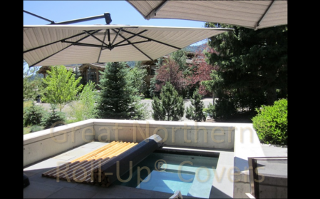 <p>Custom built Great Northern Western Red Cedar Roll-Up® Cover on an inground gunite spa.</p>
