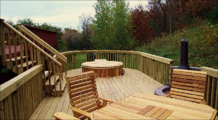 <p>Cedar hot tub added to an existing large backyard deck.</p>