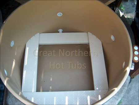 <p>Interior of a round hot tub showing custom-placed jets and adjustable bench seats.</p>