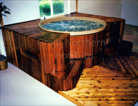 <p>  Indoor Great Northern® cedar barrel hot tub with decking and platform</p>