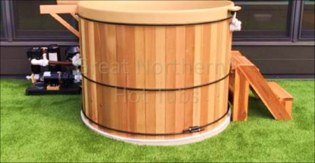 <p>Great Northern Rubadub Tub® Hot Tub with steps, equipment pack and brackets for a Western Red Cedar Roll-Up Cover® in process of installation outside a penthouse suite in Minneapolis, MN.</p>