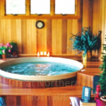 Indoor redwood hot tub built into custom wooden framing for a seamless and elegant design
