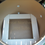Interior of a cedar hot tub featuring ample seating and powerful jets for a relaxing and therapeutic experience