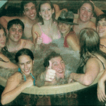 Large cedar hot tub accommodating 10 people enjoying a fun and relaxing group experience